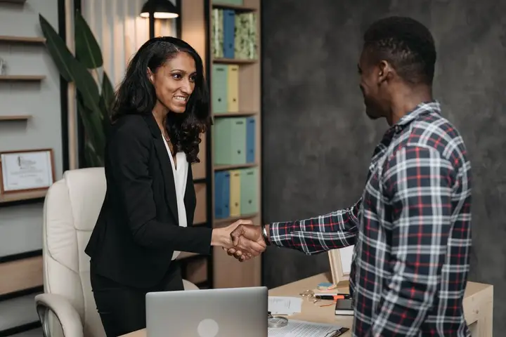A partner meeting a client at Halden & Roe